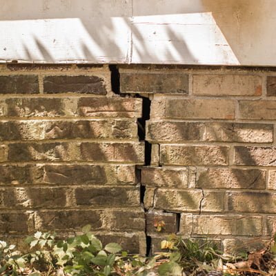 Cracked foundation brick wall