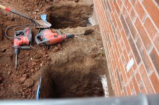 Holes excavated to install push piers.