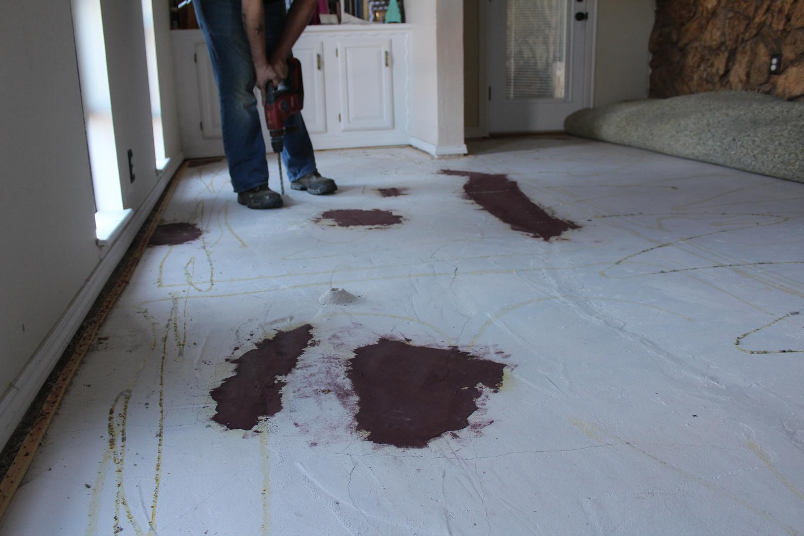 Prvisou homeowner tried to correct the problem by installing concrete leveling compound on the floor. 