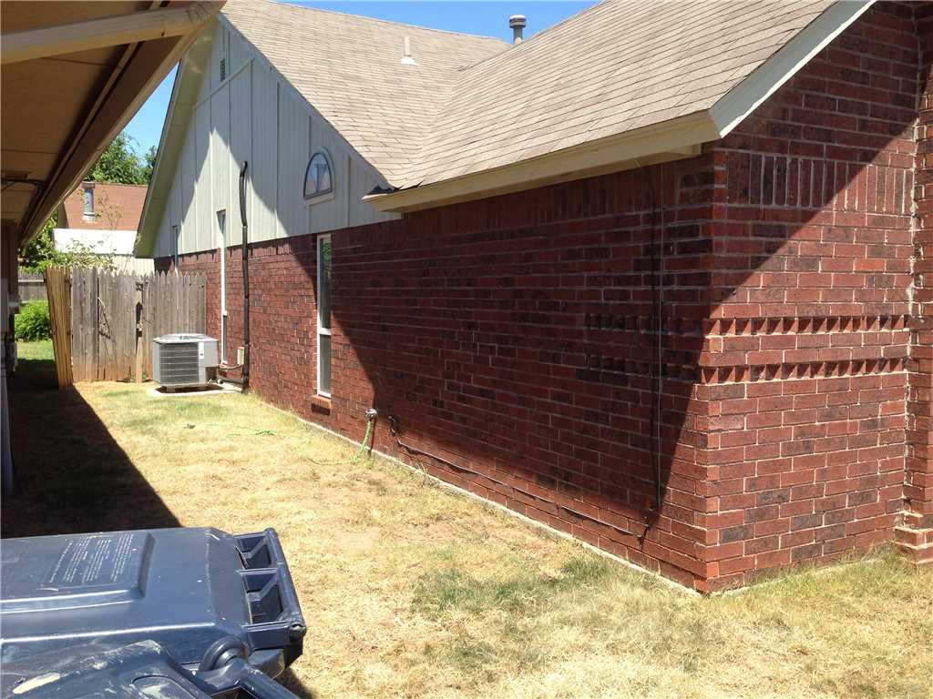Brick siding needed to be tied back to framing in the foundation.