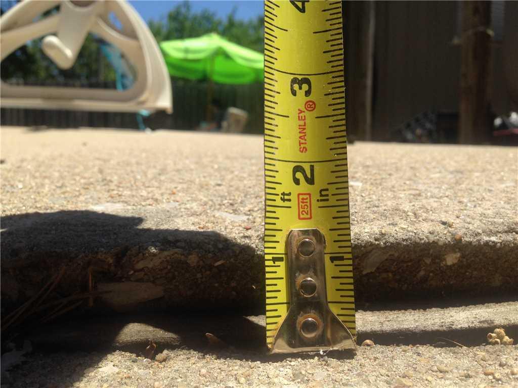 This concrete was sinking over 1 inch before being fixed by the Vesta Foundation Solutions Team.