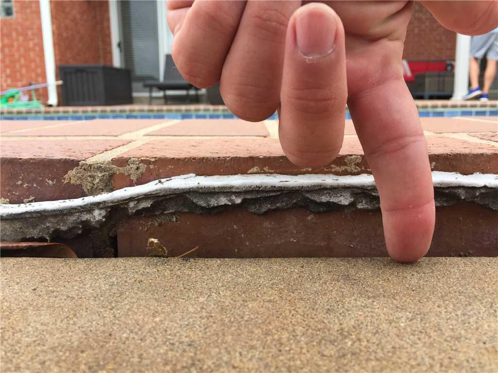 This pool deck had settled over 1 inch because of poorly compacted fill.