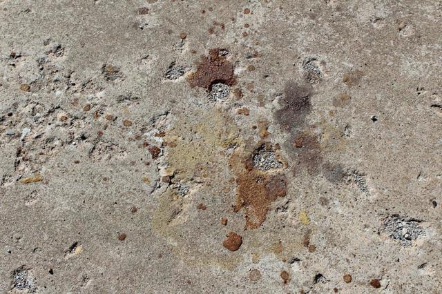 Stained and pitted concrete surface 